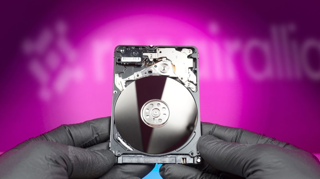 Professional data recovery technician examining failed hard drive at repair alliance dundee workshop