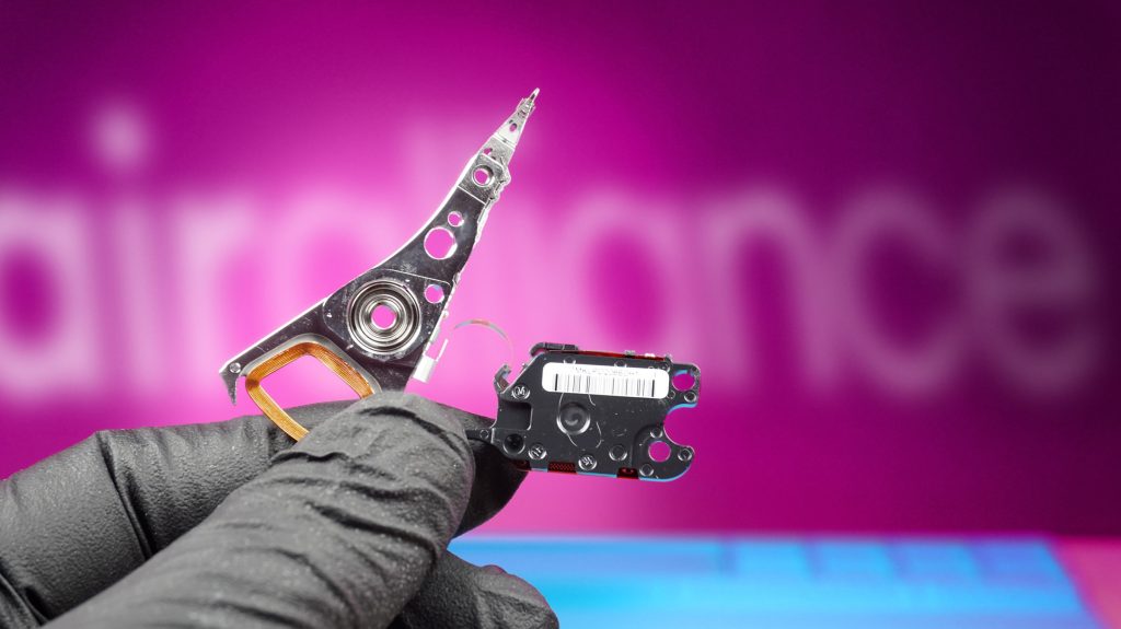 Pro data recovery technician holding broken hdd heads in repair alliance dundee