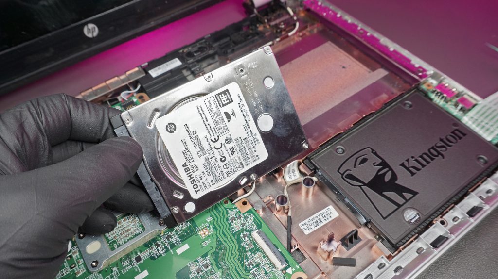 Faulty old hard drive being replaced with new laptop ssd installation in dundee