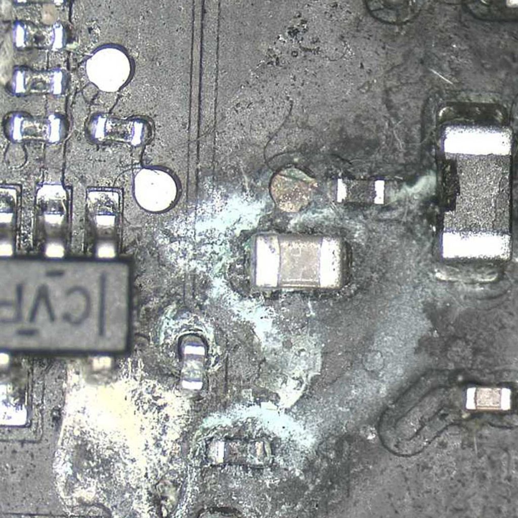 Liquid damaged motherboard before repair in dundee