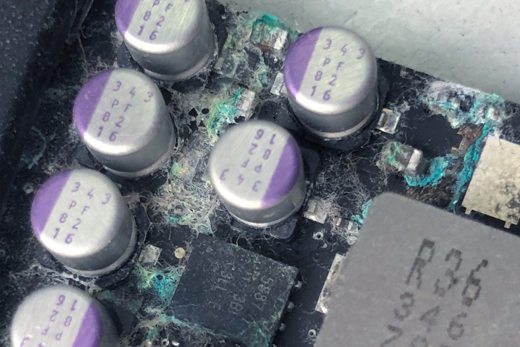Corroded macbook logic board before professional cleaning at repair alliance dundee