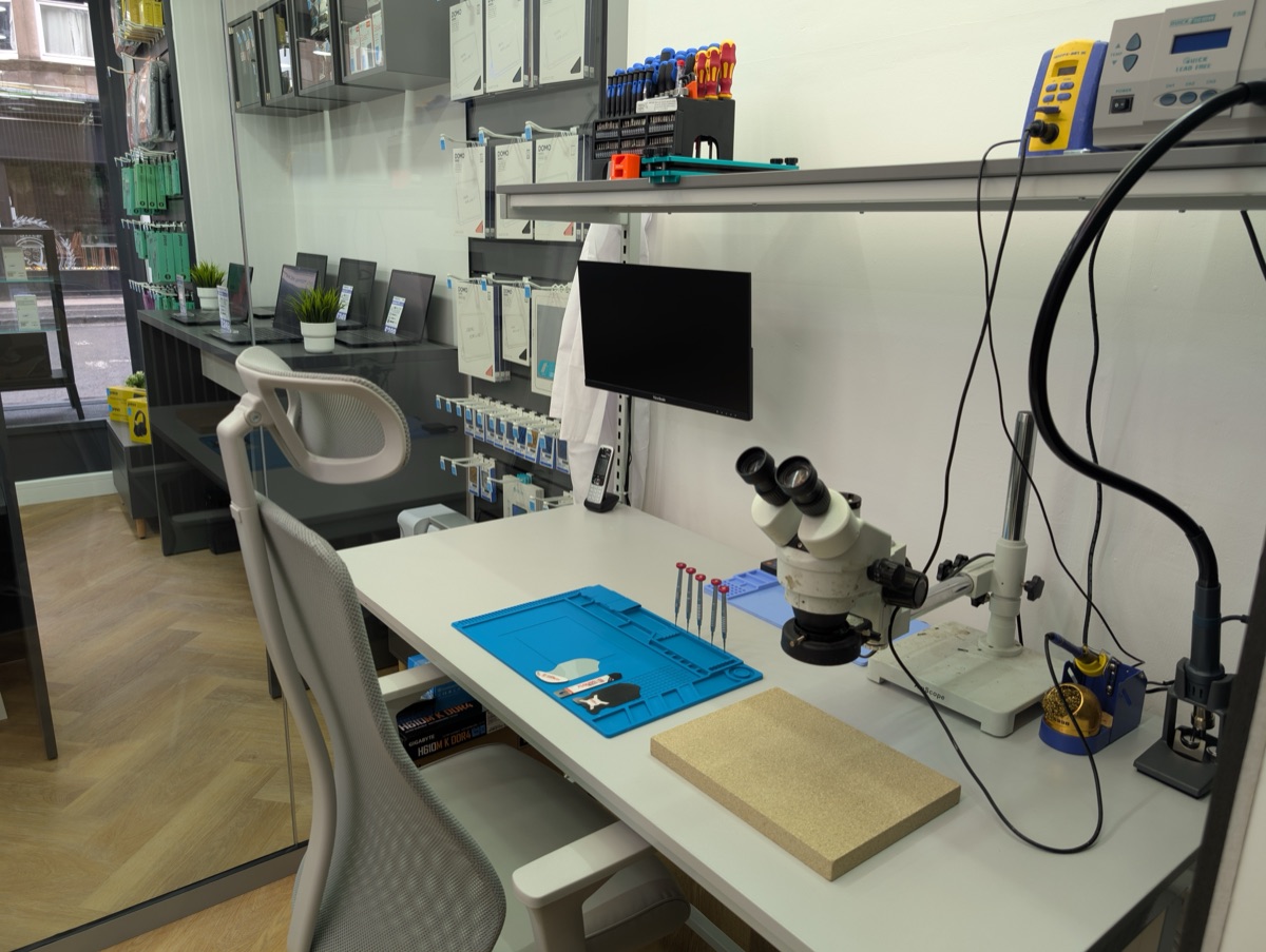 Professional repair workbench at repair alliance with microscope and soldering equipment