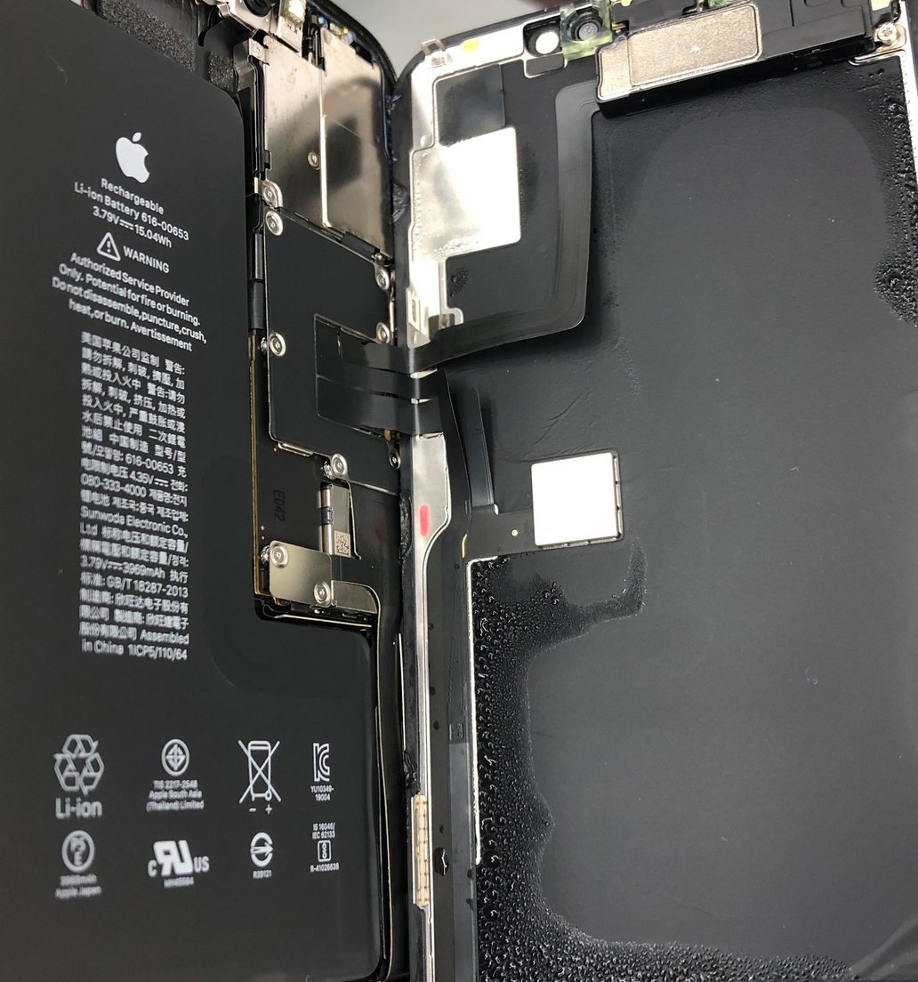 Iphone opened showing water damage and moisture on internals at repair alliance dundee