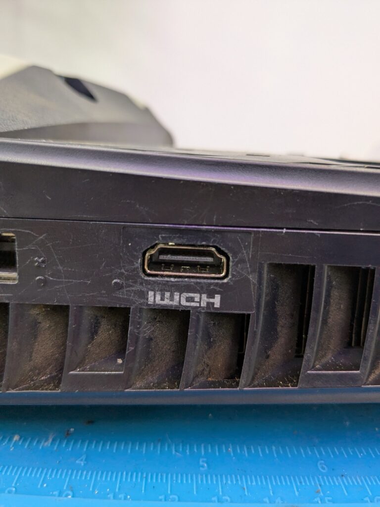 Closeup of the PlayStation 5 Slim HDMI port from outside after the repair, port socket clean and seated correctly